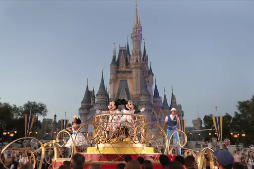 Mickey and Minnie Mouse perform during a parade as they pass by the Cinderella Castle at the Magic Kingdom theme park at Walt Disney World in Lake Buena Vista, Fla., on Jan. 15, 2020. After appointees of Florida Gov. Ron DeSantis took over Walt Disney World’s governing district in 2023, its firefighters were among the few employees who publicly welcomed them with open arms. But that warm relationship is in jeopardy now as a new administrator has reopened negotiations on a new contract that pro