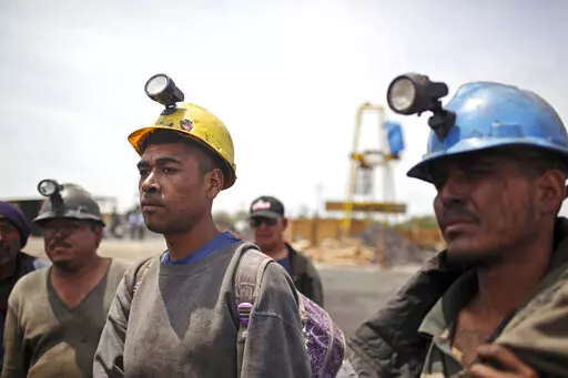 Miners helping in the rescue operation of fellow trapped miners are interviewed in San Juan de Sabinas, Coahuila state, Mexico, May 4, 2011. The administration of Mexican President Andres Manuel Lopez Obrador has resuscitated a form of coal mining so dangerous and primitive that both houses of Mexico’s Congress tried to ban it in 2012. (AP Photo/Alexandre Meneghini, File)