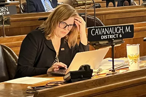 State Sen. Machaela Cavanaugh prepares to speak before the Nebraska Legislature Monday, March 13, 2023, at the Nebraska State Capital in Lincoln, Neb. Cavanaugh is in her third week of an effort to filibuster every bill that comes before the Legislature this session — even the ones she supports. The effort is a protest against conservatives' advancement of a bill that would outlaw gender-affirming therapies for those 18 and younger. Cavanaugh has declared she will "burn the session to the grou