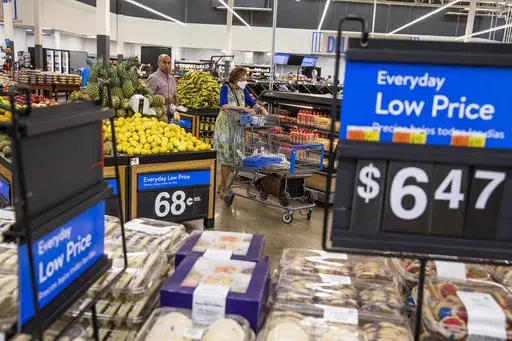 People buy groceries at a Walmart Superstore in Secaucus, New Jersey, July 11, 2024. (AP Photo/Eduardo Munoz Alvarez)