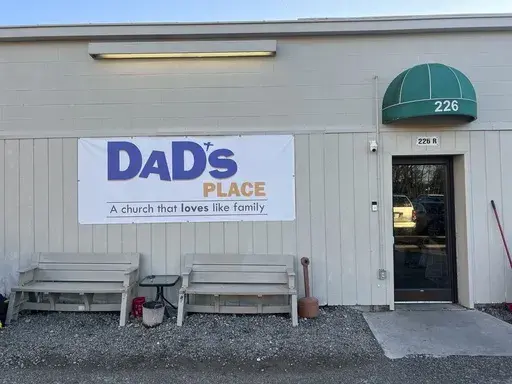 A banner announcing Dad's Place is displayed on the church's back entrance, in Bryan, Ohio, Dec. 17, 2024. (AP Photo/Patrick Aftoora-Orsagos, File)
