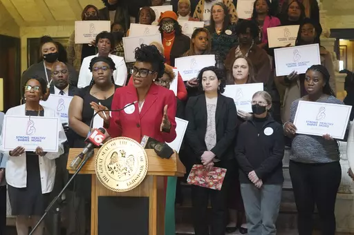 FIILE - Cassandra Welchlin, executive director of the Mississippi Black Women's Roundtable, speaks during a news conference about the group’s push for legislators to extend postpartum Medicaid from 60 days to 12 months, Jan. 26, 2023, at the Mississippi Capitol in Jackson. A Mississippi law that takes effect Saturday, July 1, 2023, authorizes a full year of postpartum Medicaid coverage. (AP Photo/Rogelio V. Solis, File)