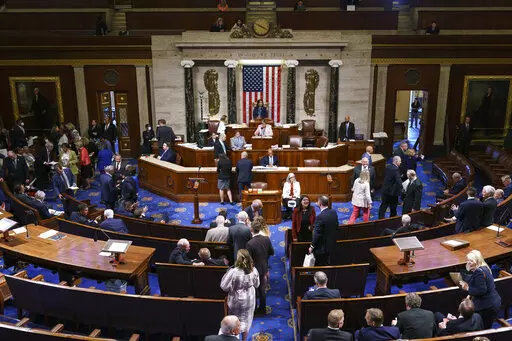 FILE - Members of the House of Representatives gather in the chamber to vote on creation of a select committee to investigate the Jan. 6 Capitol insurrection, at the Capitol in Washington, on June 30, 2021. (AP Photo/J. Scott Applewhite, File)