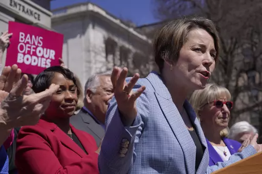 Gov. Maura Healey, front right, faces reporters as Massachusetts Attorney General Andrea Campbell, left, looks on, Monday, April 10, 2023, during a news conference in front of the Statehouse, in Boston. Massachusetts is stockpiling enough doses of mifepristone to last for more than a year Healey, a Democrat, said Monday. (AP Photo/Steven Senne)