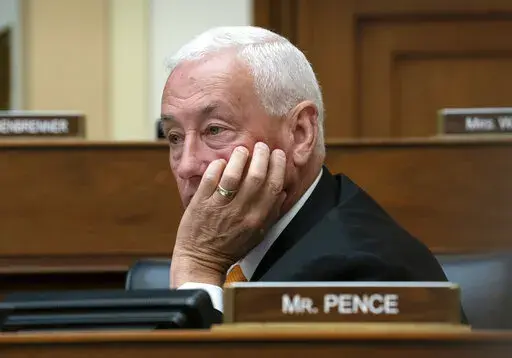 Rep. Greg Pence, R-Ind., listens as the House Foreign Affairs Committee holds a hearing titled, "The Betrayal of our Syrian Kurdish Partners," an examination of President Donald Trump's abrupt decision to withdraw from Syria and its impact on the Kurds and stability in the region, on Capitol Hill in Washington, Wednesday, Oct. 23, 2019. He is the brother of Vice President Mike Pence. (AP Photo/J. Scott Applewhite)