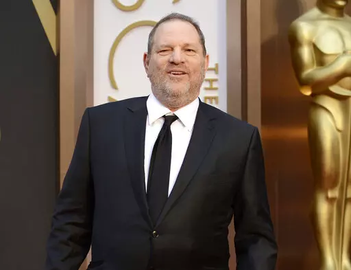 Movie mogul Harvey Weinstein arrives at the Oscars at the Dolby Theatre in Los Angeles, March 2, 2014. Opening statements are set to begin Monday in the disgraced movie mogul Harvey Weinstein's Los Angeles rape and sexual assault trial. Weinstein is already serving a 23-year-old sentence for a conviction in New York. (Photo by Jordan Strauss/Invision/AP, File)