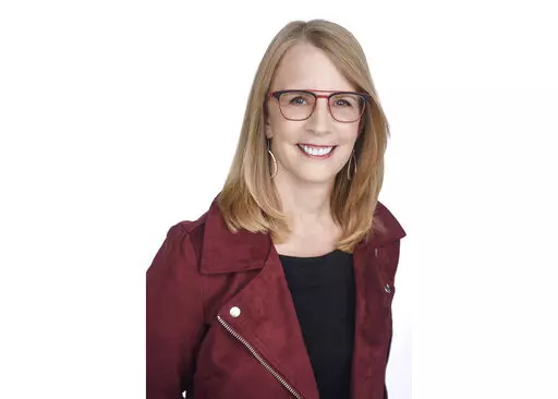 This undated file photo provided by NerdWallet shows Liz Weston, a columnist for personal finance website NerdWallet.com. While inflation is still hanging around, you can take three specific actions to better insulate your finances. First, reconsider your emergency fund. Yes, it can be too large — and you may be better off investing that cash. Next, review your home insurance coverage. Rebuilding costs are way up, and most people are underinsured anyway. Finally, check for “bracket creep” 