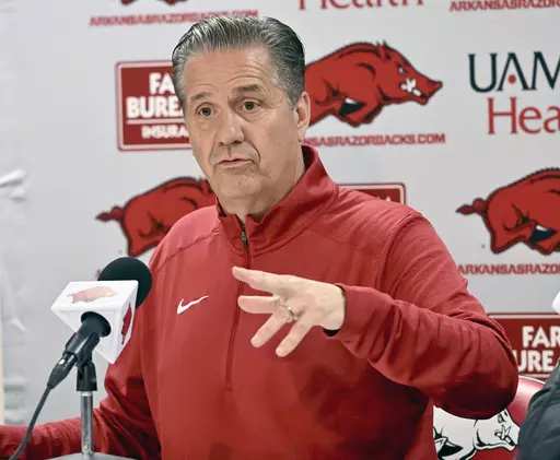 John Calipari answers questions from reporters during a news conference after being introduced as the new Arkansas head basketball coach April 10, 2024, in Fayetteville, Ark. Calipari will face his former team at Kentucky next season. The Southeastern Conference released home and away opponents for its 16 basketball teams including new members Oklahoma and Texas, Monday, May 13, 2024. (AP Photo/Michael Woods, File)