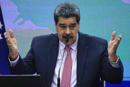 Venezuelan President Nicolas Maduro speaks during a press conference at Miraflores presidential palace in Caracas, Venezuela, Wednesday, Nov. 30, 2022. (AP Photo/Ariana Cubillos)