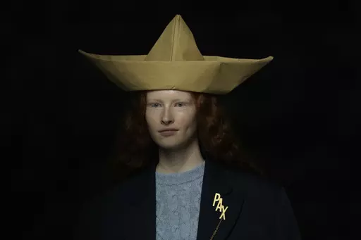 A model wears a creation as part of the Moschino women's Fall-Winter 2024-25 collection presented in Milan, northern Italy, Thursday, Feb. 22, 2024. (AP Photo/Antonio Calanni)