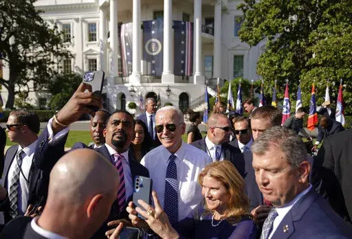 President Joe Biden poses for a photo after speaking on the South Lawn of the White House in Washington, Tuesday, Sept. 13, 2022. Biden’s popularity has improved substantially from his lowest point this summer, but concerns about his handling of the economy persist. That's according to a poll from The Associated Press-NORC Center for Public Affairs Research. (AP Photo/Andrew Harnik)