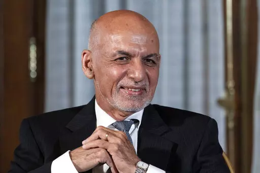 FILE - Afghan President Ashraf Ghani is seated after his meeting with U.S. President Joe Biden in Washington, June 25, 2021. In an interview aired by the BBC on Thursday, Dec. 30, 2021, Afghanistan's former president recounts his final hours in office, says he had just minutes to decide to flee and denies an agreement was in the works for a peaceful takeover, disputing accounts of former government officials, Taliban and even a former U.S. negotiator. (AP Photo/Alex Brandon, File)