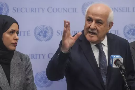 Palestinian United Nations Ambassador Riyad Mansour, right, speaks during a press conference ahead of a U.N. General Assembly vote on a resolution calling for a cease fire between Israel and Hamas in Gaza, Tuesday, Dec. 12, 2023, at U.N. headquarters. (AP Photo/Bebeto Matthews)