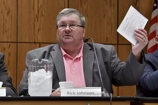 Rick Johnson chairs the committee as it meets before a capacity crowd in Lansing, Mich., June 26, 2017, at the first open meeting of the Michigan Medical Marijuana Board. Federal authorities said Thursday, April 6, 2023, that Johnson, the former head of a Michigan medical marijuana licensing board, accepted more than $100,000 in bribes and has agreed to plead guilty. (Dale G Young/Detroit News via AP, File)