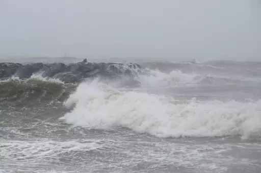 Waves crash at Outlook Beach in Hampton, Va., Sept. 30, 2022. Storms with strong gusting winds sometimes cause a phenomenon known as a meteotsunami, in which the winds push on the water and increase the wave height near the coast before it eventually crashes onto shore. (Billy Schuerman/The Virginian-Pilot via AP, File)