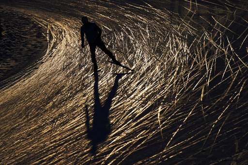 A skier trains during a cross-country skiing training session at the 2022 Winter Olympics, Monday, Feb. 14, 2022, in Zhangjiakou, China. (AP Photo/John Locher)