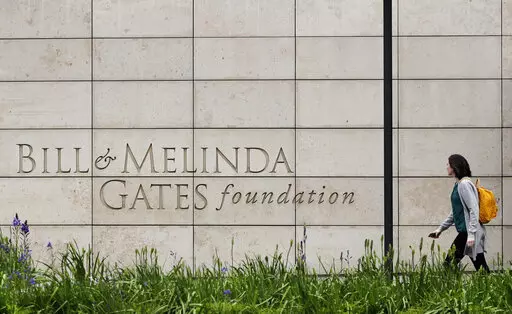 A person walks by the headquarters of the Bill and Melinda Gates Foundation on April 27, 2018, in Seattle. The Bill and Melinda Gates Foundation announced Sunday, Oct. 16, 2022, that it will commit $1.2 billion to the effort to end polio worldwide. (AP Photo/Ted S. Warren, File)
