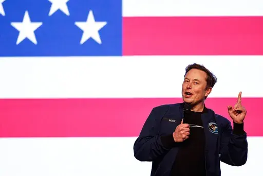 Elon Musk speaks at a town hall Sunday, March 30, 2025, in Green Bay, Wis. (AP Photo/Jeffrey Phelps)