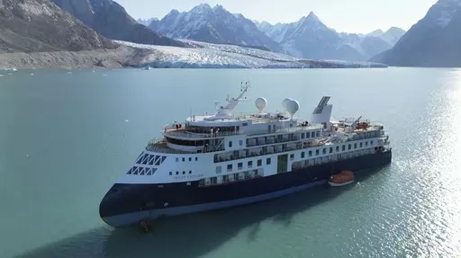 A view of the Ocean Explorer, a Bahamas-flagged Norwegian cruise ship with 206 passengers and crew, which has run aground in northwestern Greenland is pictured on Tuesday, Sept. 12, 2023. The 104.4-meter (343-foot) long and 18-meter (60 foot) wide Ocean Explorer ran aground on Monday in Alpefjord in the Northeast Greenland National Park. Another attempt to pull free a luxury cruise ship with 206 people that ran aground in the world’s northernmost national park has failed by using the high tide