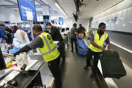 Passenger drop off their baggage at United Airlines in C Terminal at George Bush Intercontinental Airport, Thursday, Dec. 21, 2023, in Houston. The Biden administration issued final rules Wednesday, April 24, 2024, to require airlines to automatically issue cash refunds for things like delayed flights and to better disclose fees for baggage or canceling a reservation. (Brett Coomer/Houston Chronicle via AP, File)