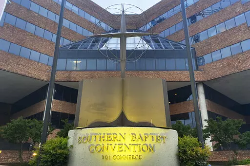 A cross and Bible sculpture stand outside the Southern Baptist Convention headquarters in Nashville, Tenn., May 24, 2022. On Tuesday, Sept. 20, 2022, the Southern Baptists' top administrative body voted to cut ties with two congregations: an LGBTQ-friendly church in North Carolina that had itself quit the denomination decades earlier and a New Jersey congregation it cited for “alleged discriminatory behavior.” (AP Photo/Holly Meyer, File)