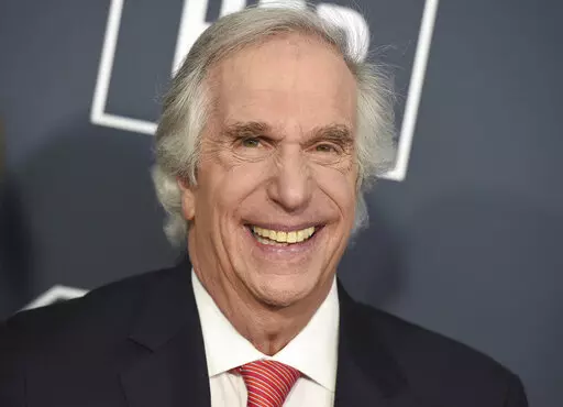 FILE — Henry Winkler arrives at the 25th annual Critics' Choice Awards, on Jan. 12, 2020, in Santa Monica, Calif. Celadon Books announced Wednesday that it has a deal with Winkler to tell his life story. The memoir, currently untitled, is scheduled for 2024. (Photo by Jordan Strauss/Invision/AP, File)