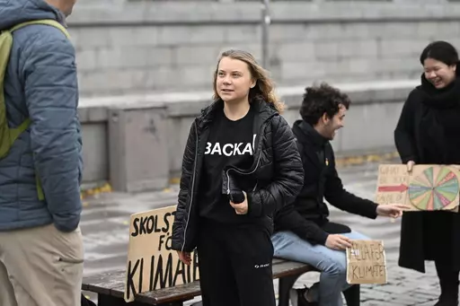 Climate activist Greta Thunberg arrives at the weekly Fridays for Future demonstration at the Mynttorget square next to the Swedish Parliament Riksdagen, in Stockholm, Sweden, on Nov. 11, 2022. Thunberg said Friday June 9, 2023 she will no longer be able to skip classes as a way to draw attention to climate change because she is graduating from high school. (Pontus Lundahl/TT News Agency via AP, File)