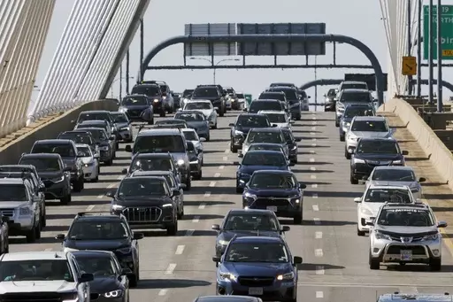 Heavy traffic heads south on Interstate 93 over the Zakim Bridge, Friday, Sep. 1, 2023, in Boston. Cars are getting an “F” in data privacy. A new study released Wednesday, Sept. 6, 2023, found that most major brands admit they may be selling your personal data, with half saying they will share it with the government or law enforcement without a court order. (AP Photo/Michael Dwyer, File)