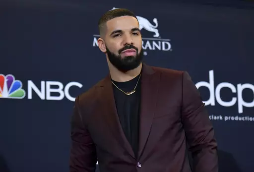 Drake poses for a photograph at the Billboard Music Awards, May 1, 2019, in Las Vegas. Hip-hop artist Drake, who had been sued for his participation in the deadly 2021 Astroworld festival in Houston in which 10 people were killed, has been dismissed from the case, a judge ruled Wednesday, April 10, 2024. (Photo by Richard Shotwell/Invision/AP, File)