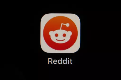 The Reddit app icon is seen on a smartphone, Feb. 28, 2023, in Marple Township, Pa. Reddit is due to begin trading on the New York Stock Exchange on Tuesday, March 21, 2024. (AP Photo/Matt Slocum, File)