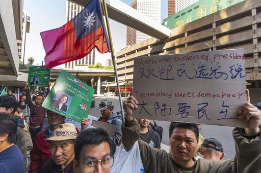 Supporters of Taiwan's President Tsai Ing-wen wait for her arrival outside The Westin Bonaventure Hotel in Los Angeles Tuesday, April 4, 2023. (AP Photo/Damian Dovarganes)