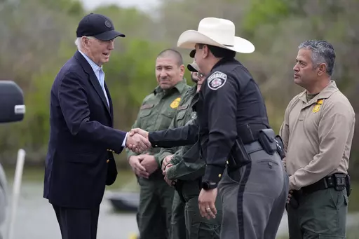 President Joe Biden talks with the U.S. Border Patrol and local officials as he looks over the southern border, Feb. 29, 2024, in Brownsville, Texas, along the Rio Grande. Democrats are trying to outflank Republicans and convince voters they can address problems at the U.S. border with Mexico as immigration likely becomes a major issue in elections that will decide control of Congress. (AP Photo/Evan Vucci, File)