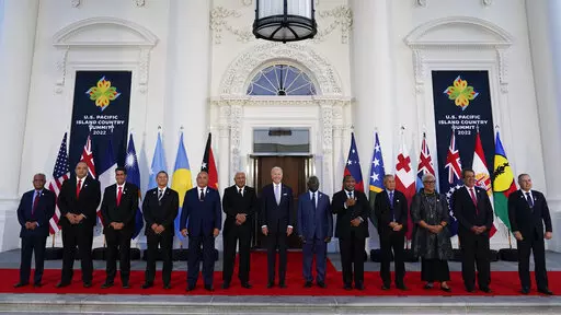 President Joe Biden, center, poses for a photo with Pacific Island leaders on the North Portico of the White House in Washington, Sept. 29, 2022. From left, New Caledonia President Louis Mapou, Tonga Prime Minister Siaosi Sovaleni, Palau President Surangel Whipps Jr., Tuvalu Prime Minister Kausea Natano, Micronesia President David Panuelo, Fiji Prime Minister Josaia Voreqe Bainimarama, Biden, Solomon Islands Prime Minister Manasseh Sogavare, Papua New Guinea Prime Minister James Marape, Marshall