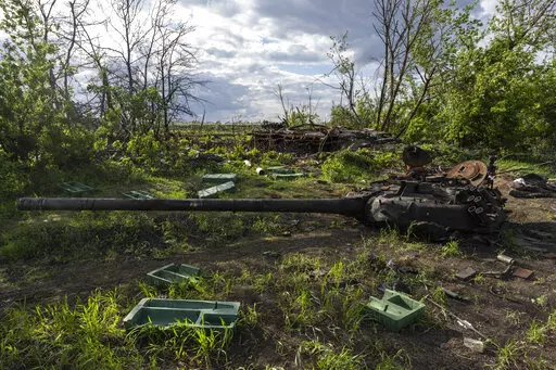 A destroyed tank near the village of Malaya Rohan, Kharkiv region, Ukraine, Monday, May 16, 2022. Twitter is stepping up its fight against misinformation with a new policy cracking down on posts that spread potentially dangerous false stories. Under the new rules, which take effect Thursday, May 19, 2022, Twitter will no longer automatically recommend posts that mischaracterize conditions during a conflict or make misleading claims about war crimes or atrocities. (AP Photo/Bernat Armangue, File)