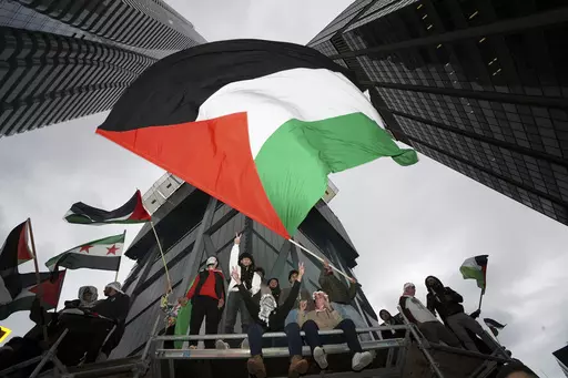 Supporters wave the Palestine flag at a march in Toronto, on Oct. 9, 2023. Before it transformed into X, Twitter was the place to turn to for live and reliable information about big news events, from wars to natural disasters. But as the Israel-Hamas war has underscored, that is no longer the case. (Arlyn McAdorey/The Canadian Press via AP, File)
