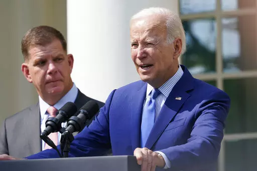President Joe Biden, with Secretary of Labor Marty Walsh, left, speaks about a tentative railway labor agreement in the Rose Garden of the White House, Thursday, Sept. 15, 2022, in Washington. (AP Photo/Susan Walsh)