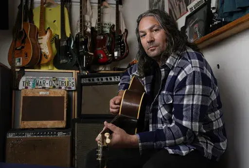 Adam Granduciel, leader of the band The War on Drugs, poses for a portrait at his studio on Monday, Aug. 26, 2024, in Burbank, Calif. (AP Photo/Chris Pizzello)