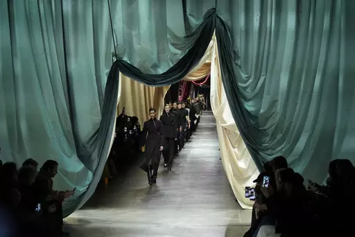 Models wear creations during the Fendi women's Fall-Winter 2024-25 collection presented in Milan, northern Italy, Wednesday, Feb. 21, 2024. (AP Photo/Antonio Calanni)