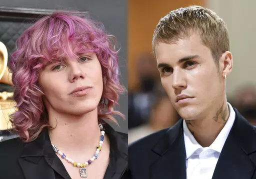 The Kid Laroi appears at the 64th Annual Grammy Awards in Las Vegas on April 3, 2022, left, and Justin Bieber appears at The Metropolitan Museum of Art's Costume Institute benefit gala in New York on Sept. 13, 2021. “Stay,” the smash hit by The Kid Laroi and Justin Bieber topped Apple Music’s global song chart in 2022.  (AP Photo)