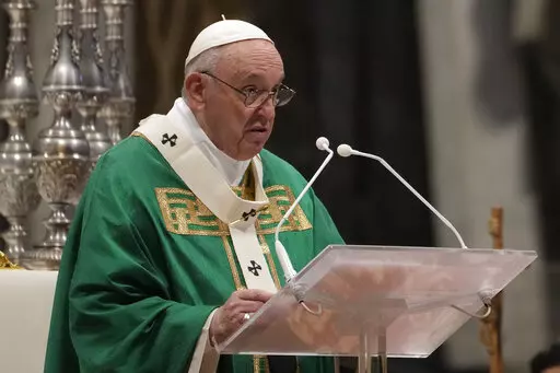 Pope Francis celebrates Mass on the Day of the Poor in St. Peter's Basilica, at the Vatican, Sunday, Nov. 14, 2021. (AP Photo/Gregorio Borgia)