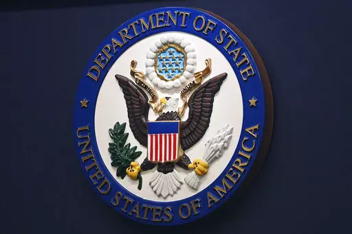 The State Department seal is seen on the briefing room lectern at the State Department in Washington, Jan. 31, 2022. Everyday Americans will be able to help refugees adjust to life in the U.S. in a program being launched by the State Department. The goal is to give private citizens a role in resettling the thousands of refugees who come to America every year. The State Department is calling the new program the Welcome Corps.(Mandel Ngan, Pool via AP, File)