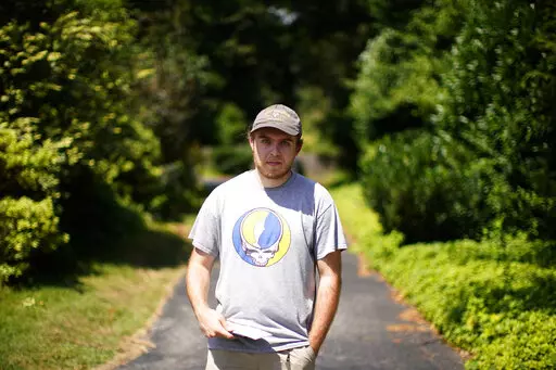 Nick Marcil, 24, of Wayne, Pa., poses for a photograph on Wednesday, Aug. 24, 2022, in Devon, Pa. (AP Photo/Matt Slocum)