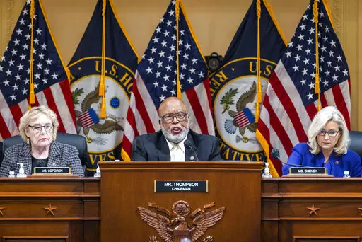 Chairman Bennie Thompson, D-Miss., center, speaks as the House select committee investigating the Jan. 6 attack on the U.S. Capitol holds its final meeting on Capitol Hill in Washington, Dec. 19, 2022. From left, Rep. Zoe Lofgren, D-Calif., Thompson and Vice Chair Liz Cheney, R-Wyo. A report set to be released by House investigators will conclude that then-President Donald Trump criminally plotted to overturn his 2020 election defeat and “provoked his supporters to violence” at the Capitol w