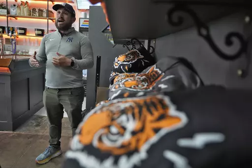 Roberto Torres, owner of the Blind Tiger Cafe gestures during an interview Wednesday, Jan. 10, 2024, in Tampa, Fla. (AP Photo/Chris O'Meara)