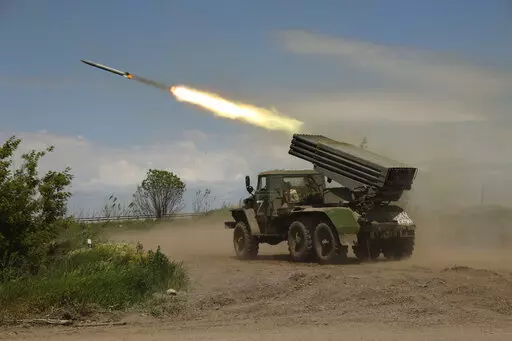 A Donetsk People's Republic militia's multiple rocket launcher fires from its position not far from Panteleimonivka, in territory under the government of the Donetsk People's Republic, eastern Ukraine, Saturday, May 28, 2022. Day after day, Russia is pounding the Donbas region of Ukraine with relentless artillery and air raids, making slow but steady progress to seize the industrial heartland of its neighbor. With the conflict now in its fourth month, it’s a high-stakes campaign that could dic
