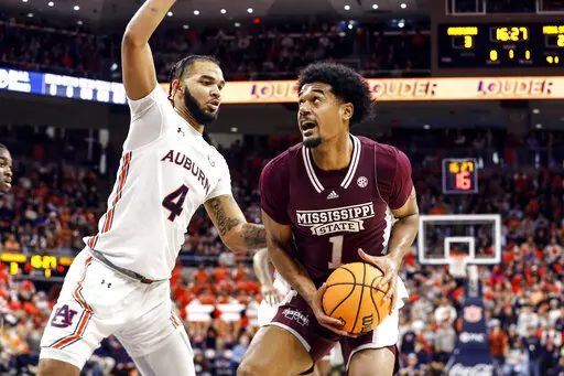 Mississippi State forward Tolu Smith (1) looks for a shot as Auburn forward Johni Broome (4) defends during the first half of an NCAA college basketball game Saturday, Jan. 14, 2023 in Auburn, Ala.. (AP Photo/Butch Dill)