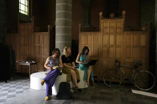 Confessional booths are stacked into a corner at the Sacred Heart church in Mechelen, Beligum, Monday, June 19, 2023. Across Europe, the continent that nurtured Christianity for most of two millennia, many churches, convents, beguinages and chapels stand empty as faith and church attendance have dwindled over the past half century. Many are now been repurposed to preserve their historical and architectural relevance, while others have opened up to non-religious activities to expand their use. (A