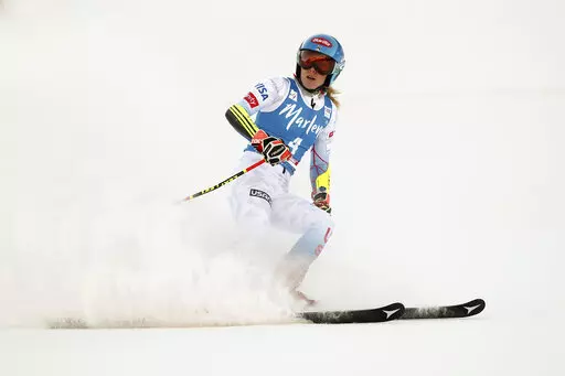 United States' Mikaela Shiffrin checks her time at the finish area of an alpine ski, women's World Cup giant slalom, in Kronplatz, Italy, Jan. 25, 2022. Empathizing with other athletes’ frank conversations about mental health got Shiffrin thinking about what awaits her at the Beijing Olympics. (AP Photo/Gabriele Facciotti, File)