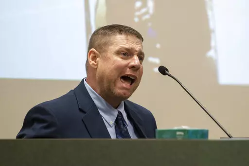 Jacob Blair Scott, who is accused of sexually assaulting a minor, cries out while being cross-examined by Assistant District Attorney Justin Lovorn, during his trial in Jackson County Circuit Court in Pascagoula, Miss., on Wednesday, June 1, 2022. On Monday, Aug. 22, 2022, Scott pleaded guilty in federal court to faking his own death off the Alabama coast to try to avoid sexual abuse charges in Mississippi. (Hannah Ruhoff/The Sun Herald via AP, File)