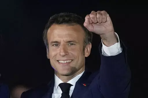 French President Emmanuel Macron celebrates with his supporters in Paris, France, Sunday, April 24, 2022. French President Emmanuel Macron's reelection has bolstered his standing as a senior player in Europe. Macron is now expected to push for strengthening the 27-nation bloc and throw all his weight behind efforts to end the war in Ukraine. (AP Photo/Christophe Ena, File)
